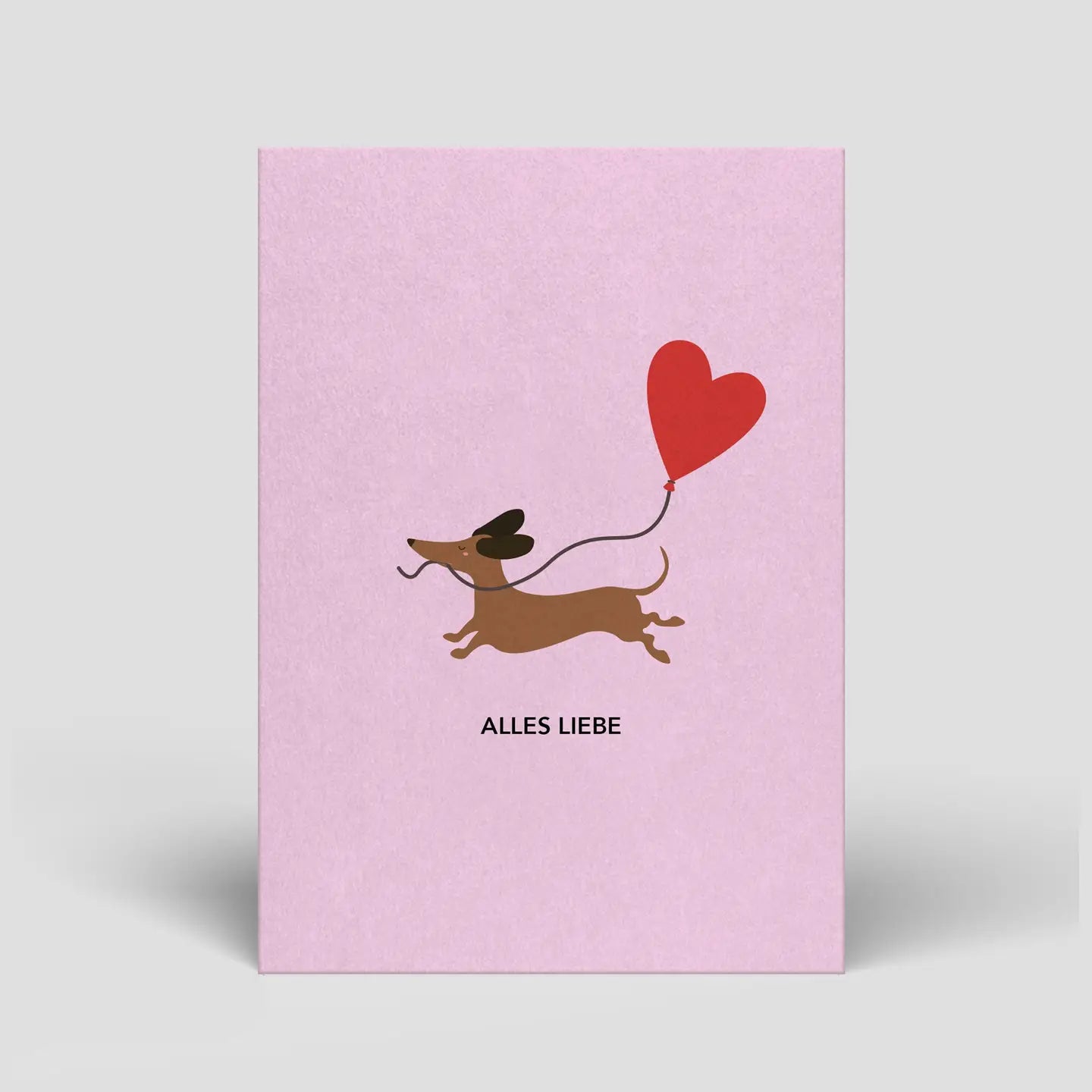 Postkarte Dackel mit Herz